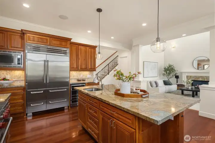A large Sub-Zero fridge and wine/beverage cooler provide plenty of storage space in the kitchen.