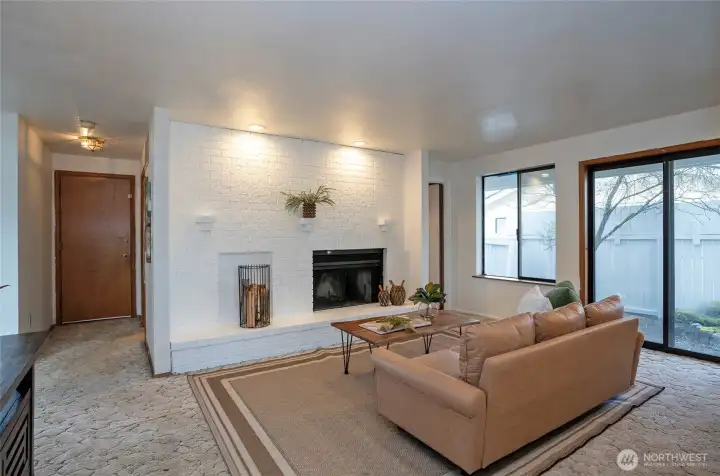 View of garage door and hallway bathroom to the left.
