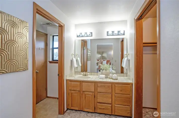 Open to sinks with private door to shower/bath toilet/closet