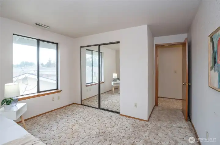 3rd bedroom upstairs, with mirror sliding closet doors