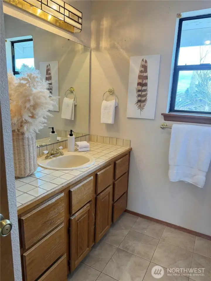 upstairs bathroom sink, cabinet and mirror
