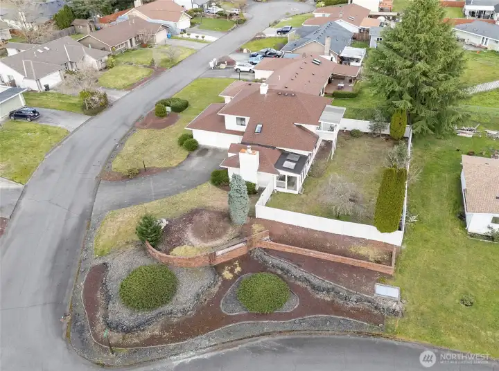 Entrance of the community and large corner lot.