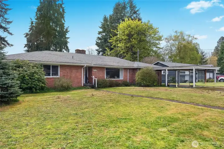 Front of house with spacious front yard
