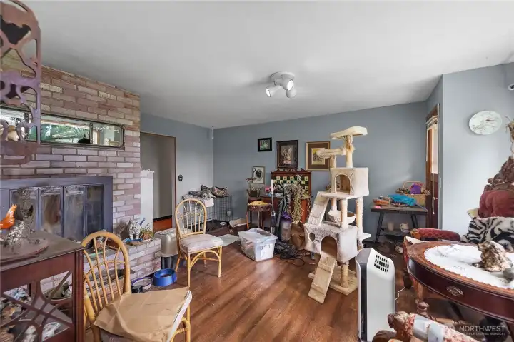 secondary living room with wood fireplace