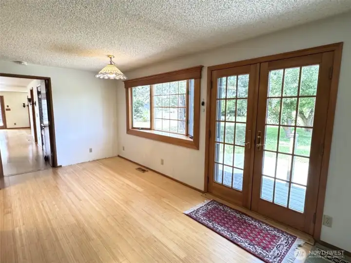 Dining area and doors out to back yard. Dining area and doors out to back yard.