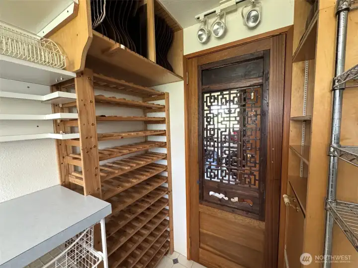 Wine racks, and tray storage slots above.