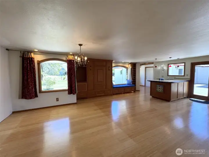 Wet bar to the right.  Between the windows, are a Murphy bed and window seat with more storage.