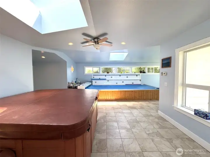 Coming in from the deck. Hot tub to the left, swim spa ahead