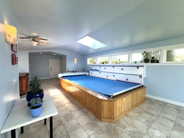 Swim spa, and looking toward the garage entry