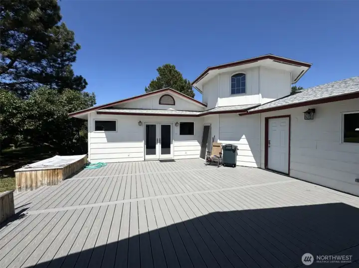 Deck from pool/spa wing to the rec room.