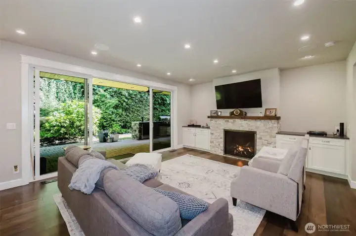 16' Sliders and cozy gas fireplace.