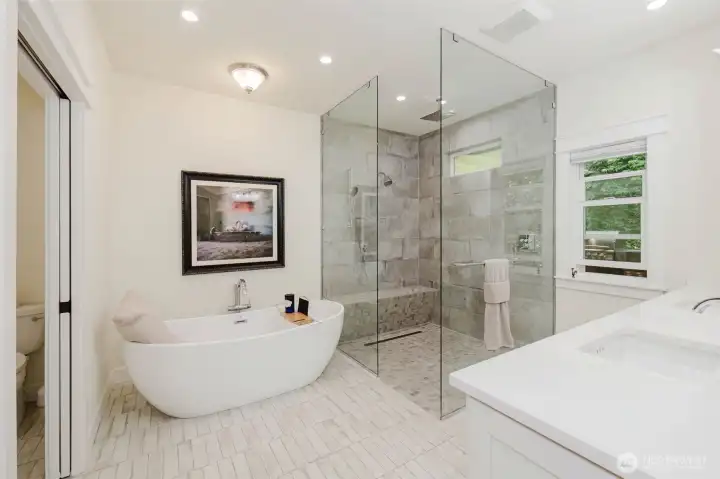 Primary bath boasts a no lip shower, heated tile floor, heated toilet seat.