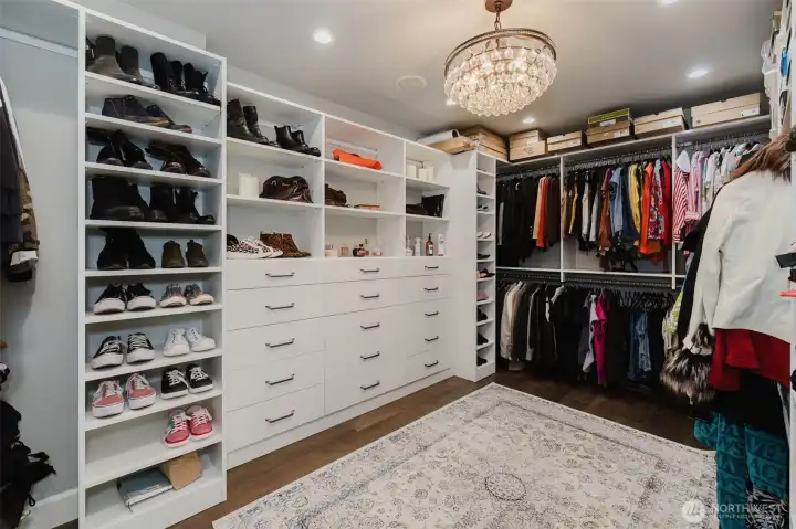Check out these custom built-ins in the primary walk-in closet.