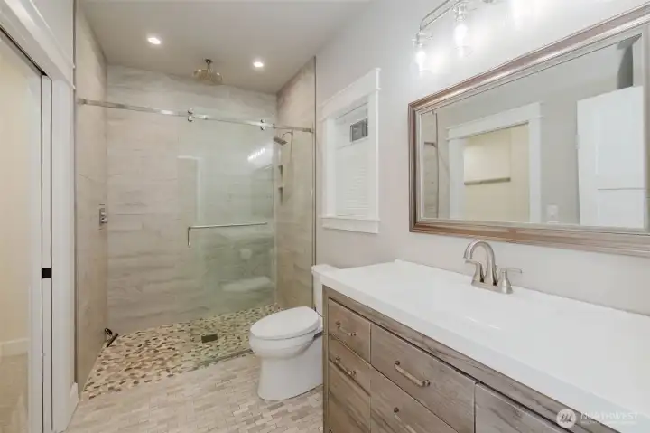 MIL/Guest bathroom with no lip shower, heated tile floor, heated toilet seat.