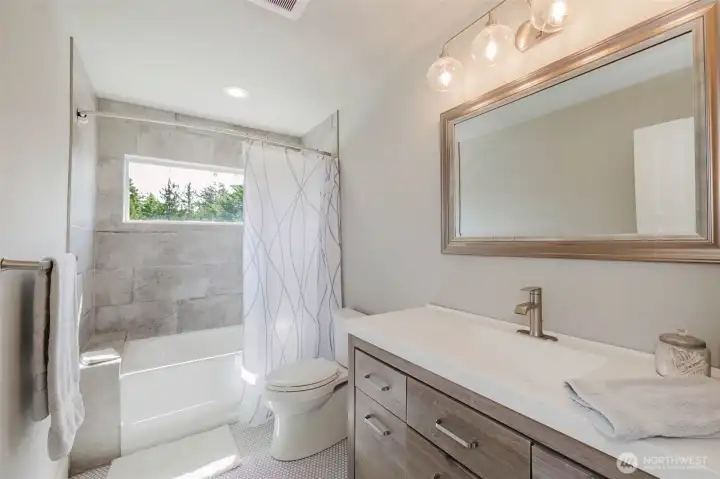 Private bath off of bedroom #4.