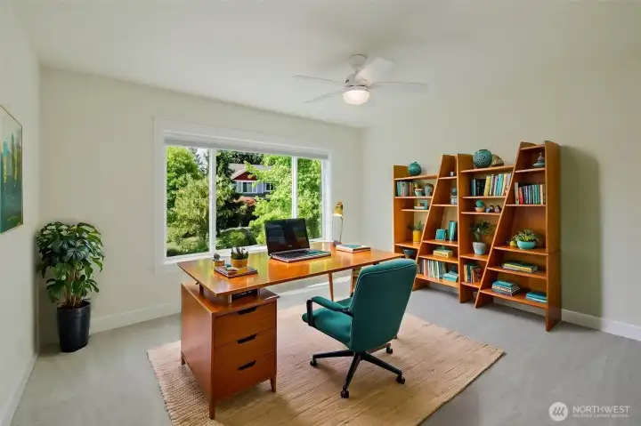 Virtually staged as an office, upstairs.