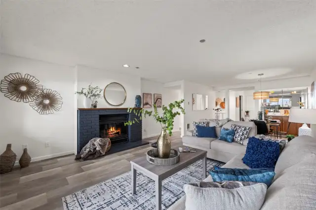 Living space lives large with private deck, dining, retro bar, and cozy wood-burning fireplace.