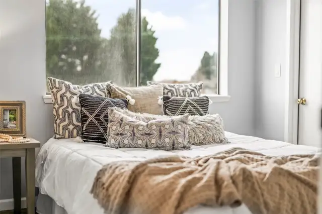 The Secondary bedroom features ample closet space and direct access to the deck off the kitchen, where you can enjoy views of the Narrows.