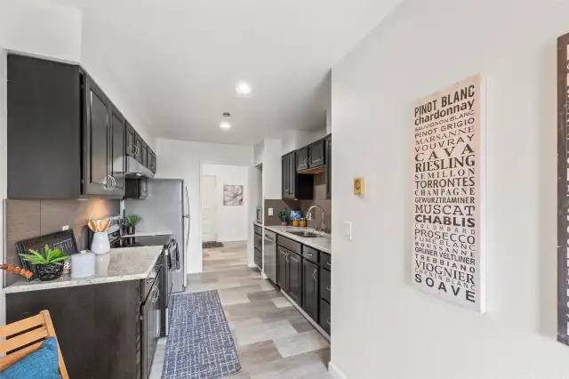 A pocket door provides privacy from the entry, creating a seamless flow between spaces.