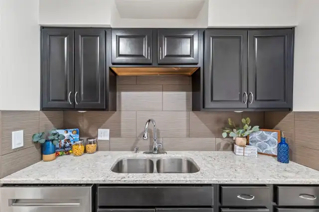 Thoughtfully designed kitchen with abundant cabinetry and storage, making it easy to keep everything organized.