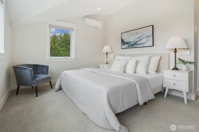 Upper level primary suite has mini split & vaulted ceilings.