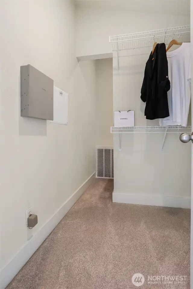 Primary walk-in closet has bonus storage space.