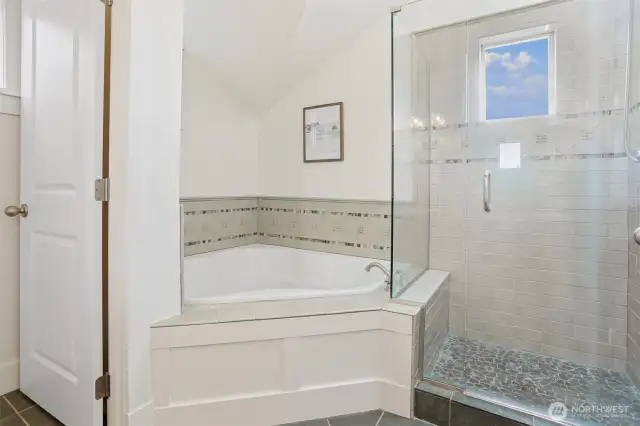Primary bath has deep soaking/jetted tub and sperate ceramic shower & South facing window.