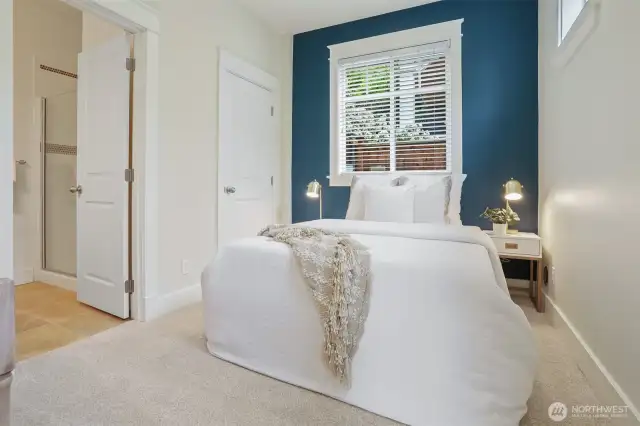 Lower level daylight bedroom has own private ceramic bath.