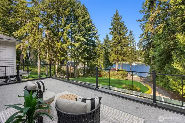 French doors to expansive views of the grounds and waterfront.