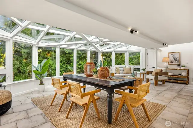 Absolutely amazing! Outside you will find a covered hot tub adjacent to the south side of this sunroom.