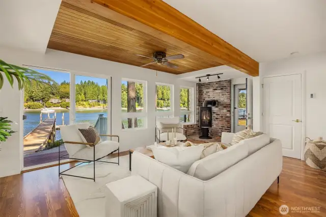 Living room with sweet views and slider to patio and dock.