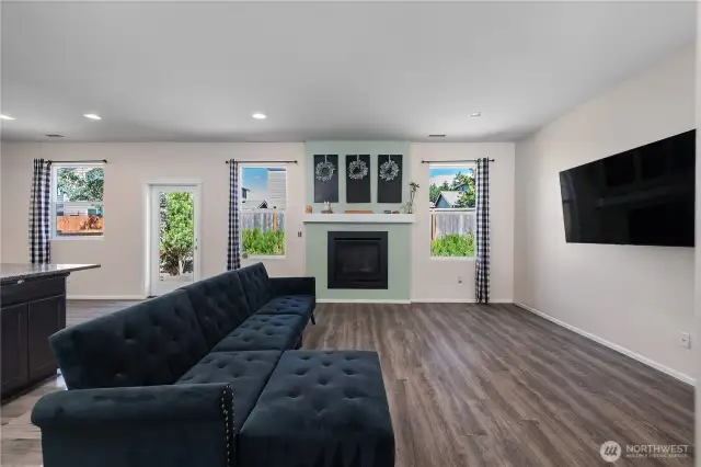 Outdoor lighting abounds with the ample windows on the back side of this home.