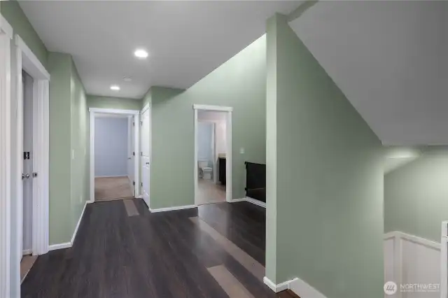 2nd floor landing with access to laundry room, Primary bedroom, 2 cozy bedrooms and a large bedroom and or bonus room.