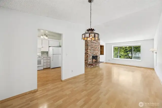 Open living and dining room space on the upper level with easy care laminate flooring.