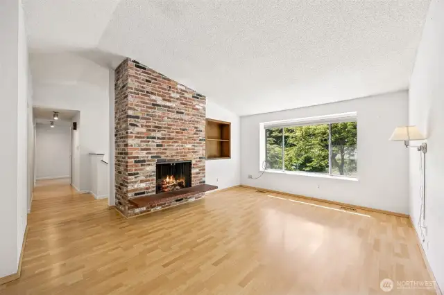 Wood burning fireplace and cute little nook in the wall.