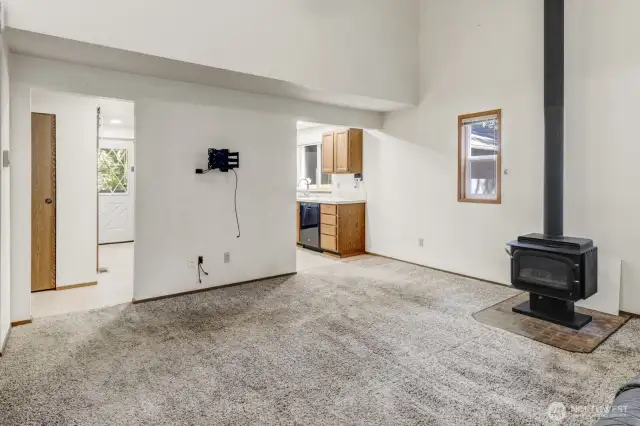 Two openings lead to the Kitchen.