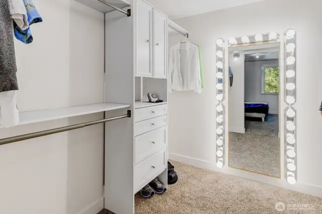 Walk-in closet with built-ins on both side - so much storage space!