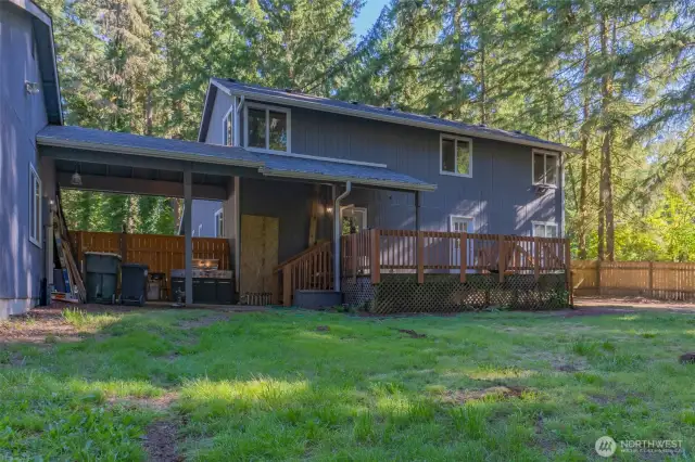 Breezeway leads to the detached garage with workshop space.