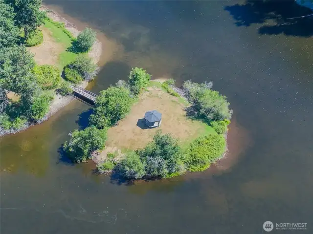 Take a stroll across the bridge to the island in the lake with pavilion.