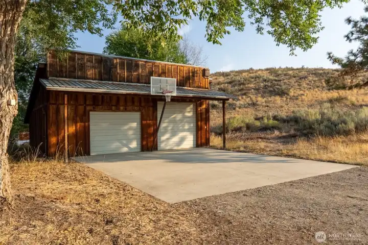 Two car garage for covered parking and extra storage.