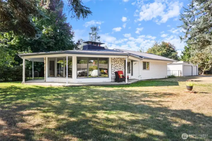 Delightful wrap around porch on this amazing unique home.