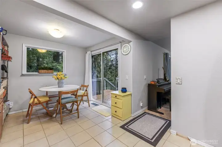 Door to private side deck and entry to living room.