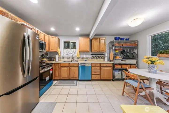 Charming kitchen with plenty of storage. Protective plastic still on range and dishwasher.