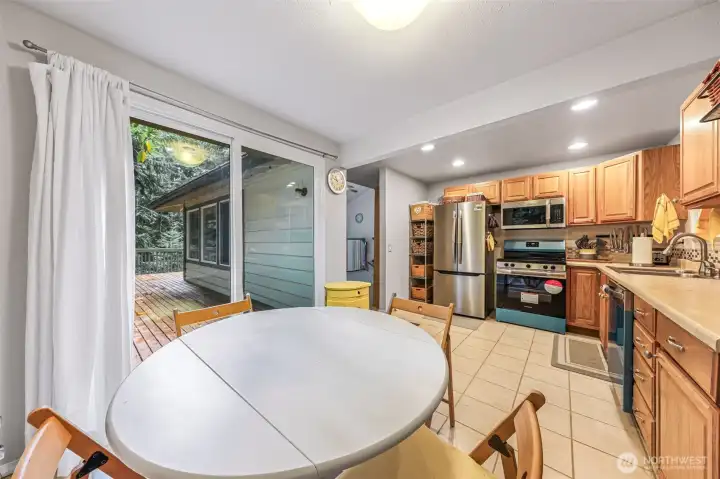 Cute kitchen with new appliances.