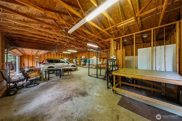 960 square ft garage with brand new roof and gutters. Lots of shop space and it's own water spigot outside.