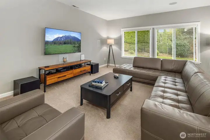 Whether it’s movie night or lively conversation, this open and inviting space sets the stage for effortless entertaining and everyday living.