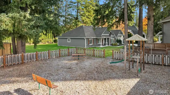 A charming neighborhood playground sits just steps away, offering a welcoming space for play, laughter, and community connection.