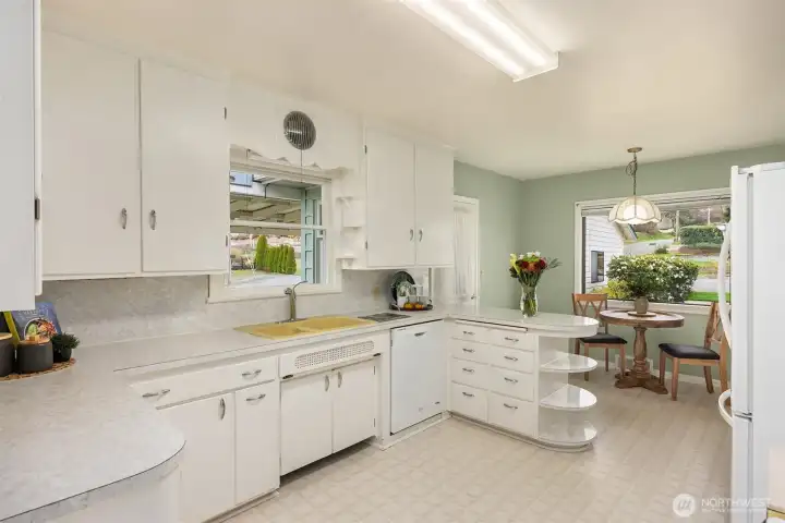 A vintage kitchen greets you as you enter the main home through a mud room
