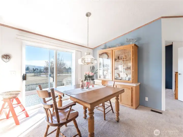 Light-filled dining room with access to the new Trex deck