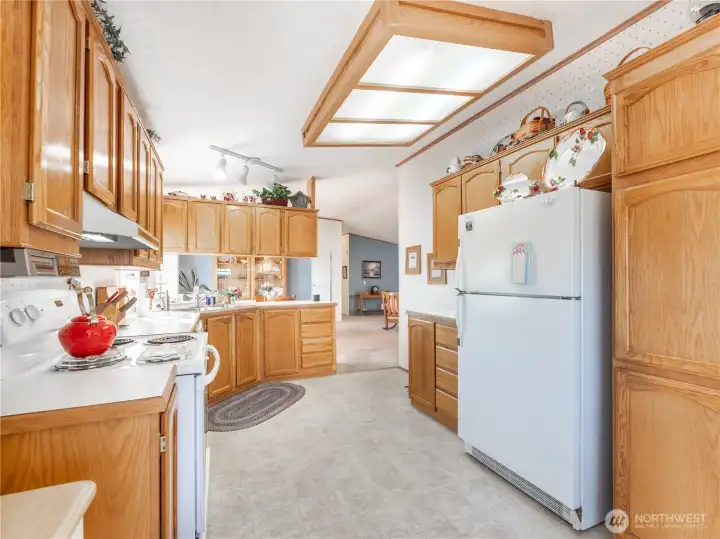 Bright kitchen featuring new appliances and ample cabinet space